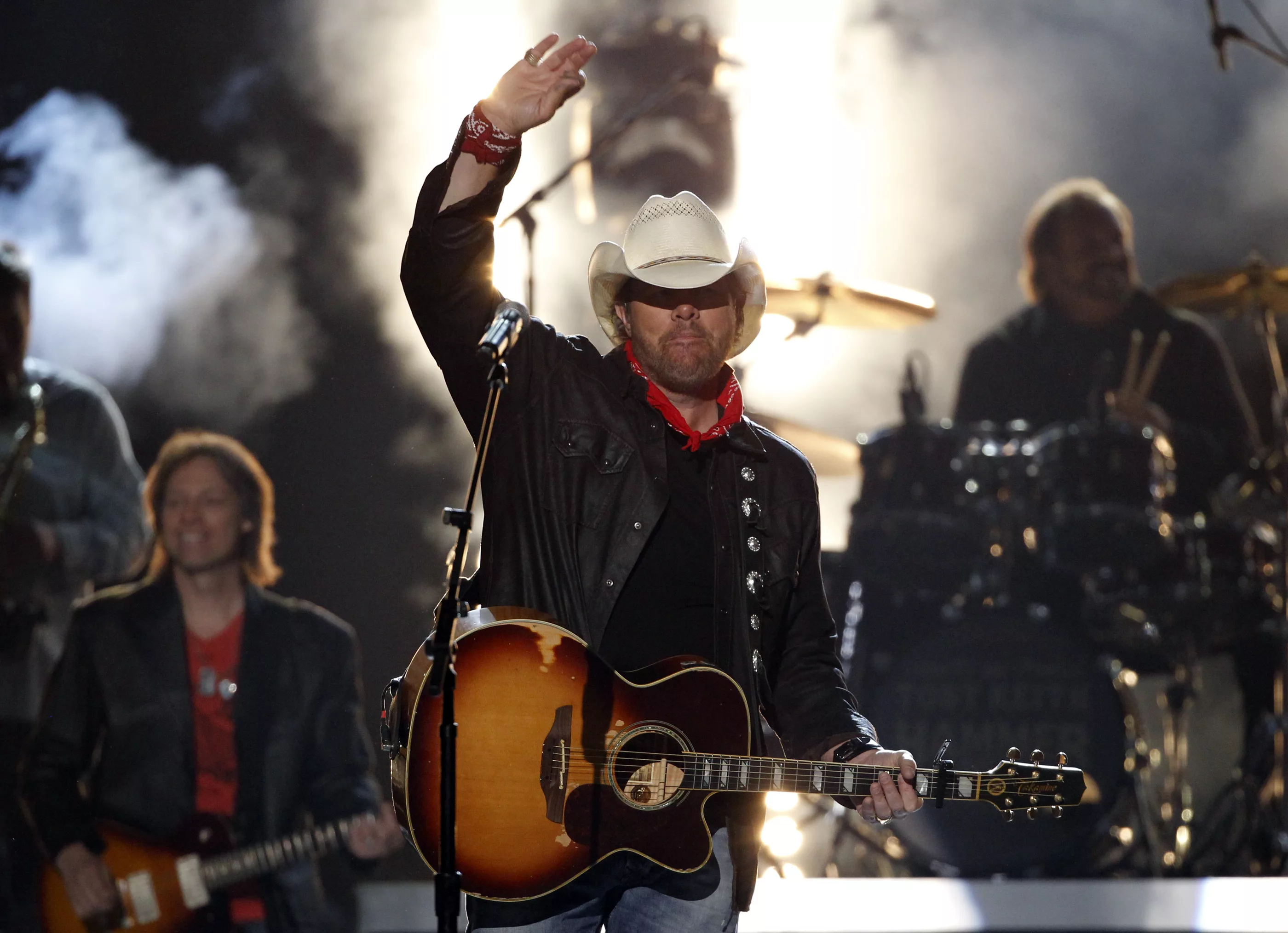 toby-keith-waves-after-performing-shut-up-and-hold-on-at-the-49th-annual-academy-of-country-music-awards-in-las-vegas