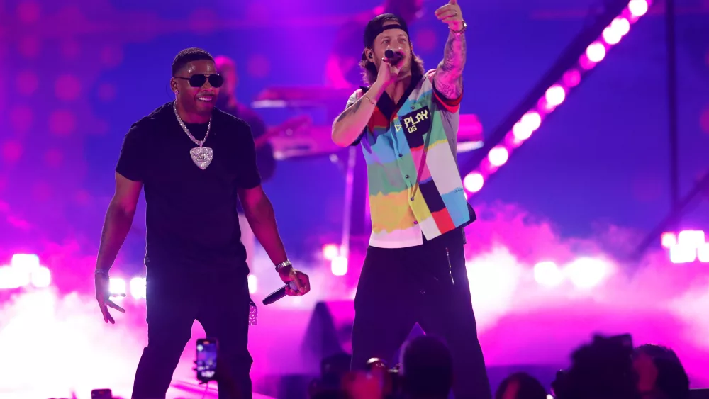 nelly-performs-with-tyler-hubbard-during-the-first-day-of-the-iheartradio-music-festival-at-t-mobile-arena-in-las-vegas-2