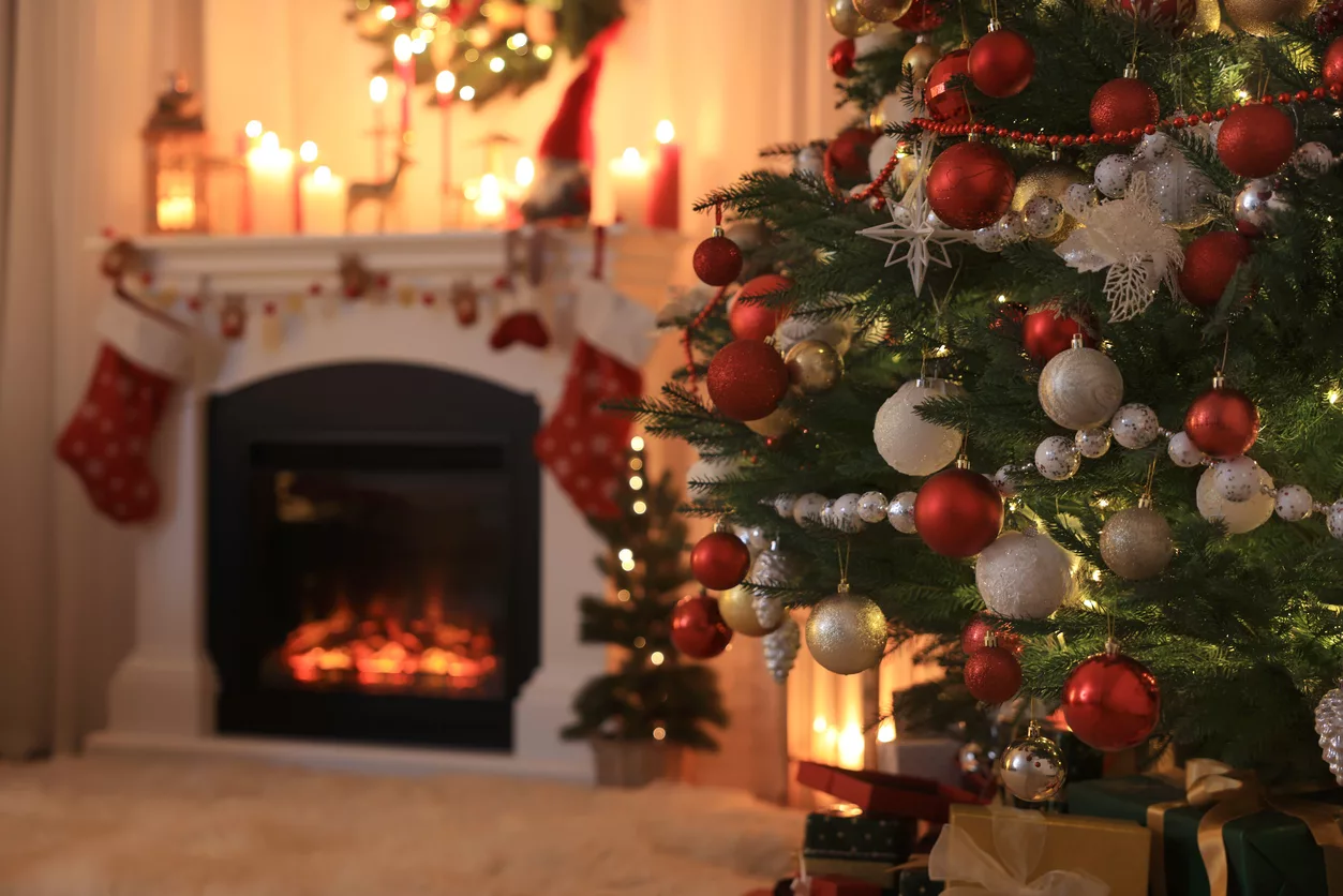 festive-living-room-interior-with-christmas-tree-near-fireplace