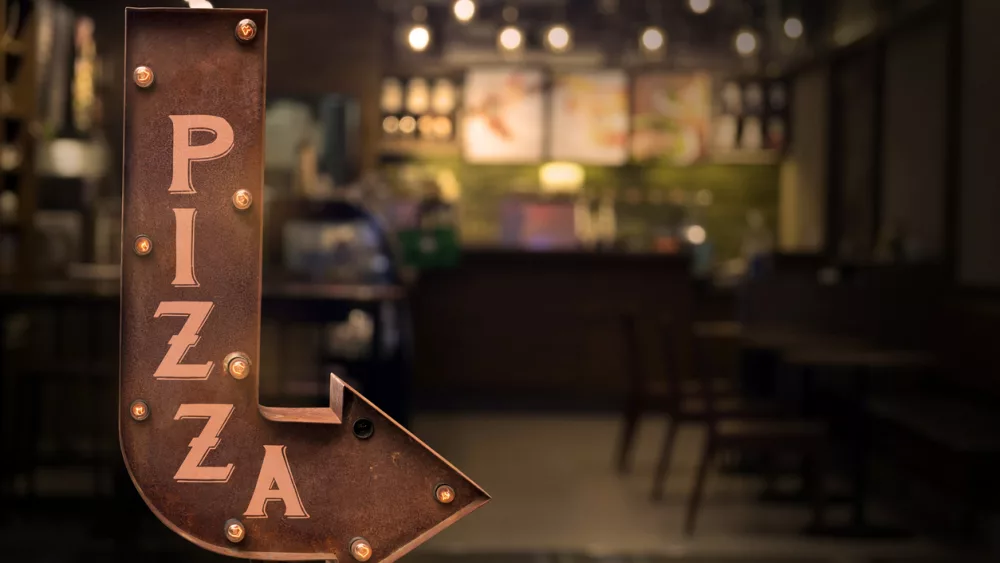 pizza-shop-signboard-in-front-of-the-store