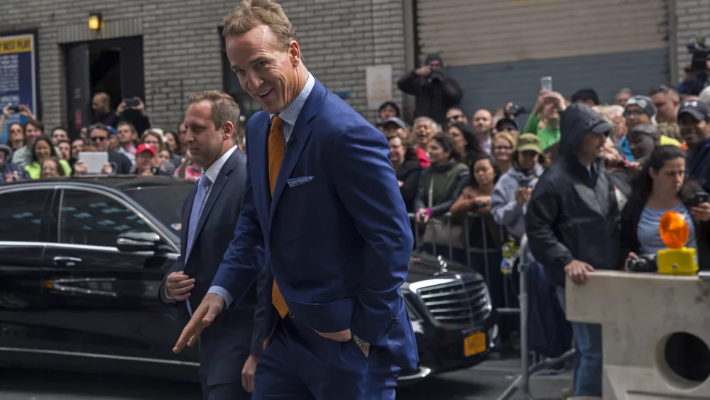 football-player-peyton-manning-arrives-at-ed-sullivan-theater-in-manhattan-as-david-letterman-prepares-for-the-taping-of-tonights-final-edition-of-the-late-show-in-new-york