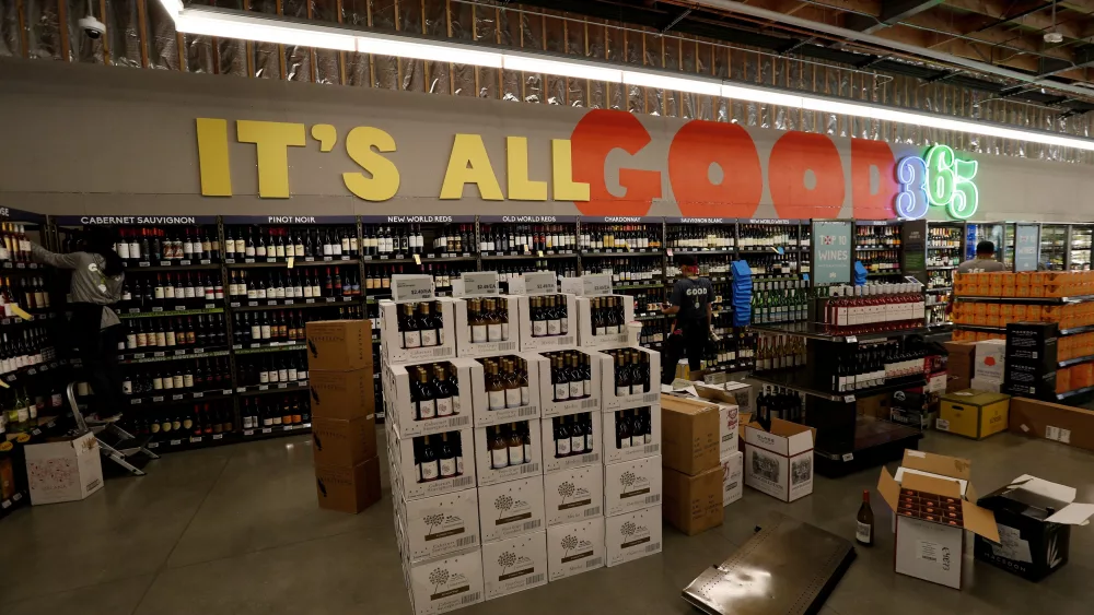 file-photo-employees-arrange-wine-at-a-365-by-whole-foods-market-grocery-store-is-pictured-ahead-of-its-opening-day-in-los-angeles