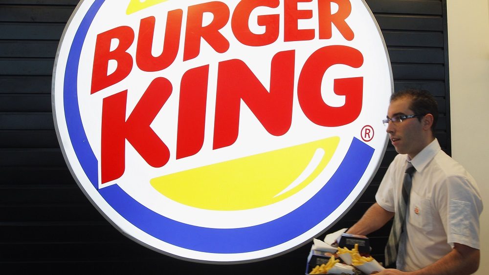 an-employee-prepares-a-food-order-on-the-opening-day-of-the-burger-king-restaurant-at-the-marignane-airport-hall
