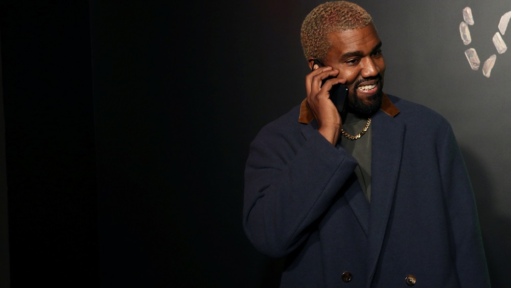 rapper-kanye-west-talks-on-the-phone-before-attending-the-versace-presentation-in-new-york