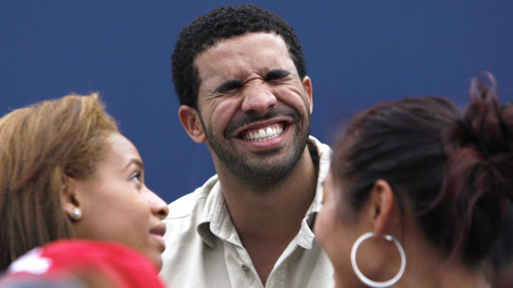 canadian-rapper-drake-laughs-as-he-watches-serena-williams-of-the-u-s-play-samantha-stosur-of-australia-in-toronto