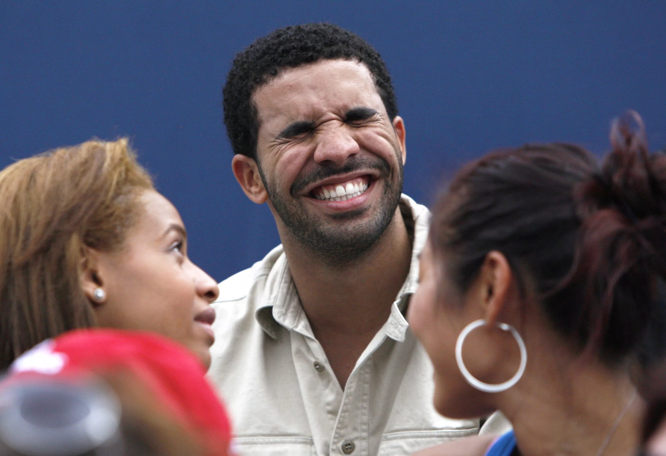 canadian-rapper-drake-laughs-as-he-watches-serena-williams-of-the-u-s-play-samantha-stosur-of-australia-in-toronto-2