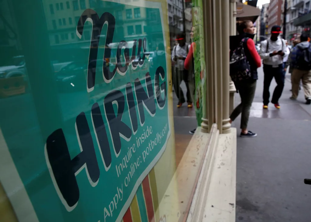 a-now-hiring-sign-is-posted-on-a-restaurant-in-manhattan-in-new-york
