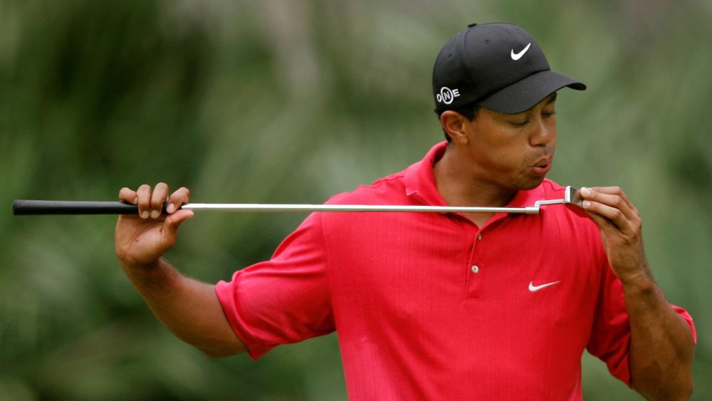 file-photo-tiger-woods-blows-on-his-putter-on-the-10th-hole-during-final-round-play-of-the-tournament-players-championship-in-ponte-vedra