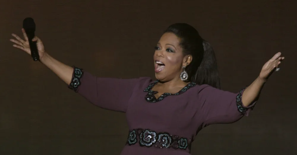oprah-winfrey-gestures-during-the-taping-of-oprahs-surprise-spectacular-in-chicago