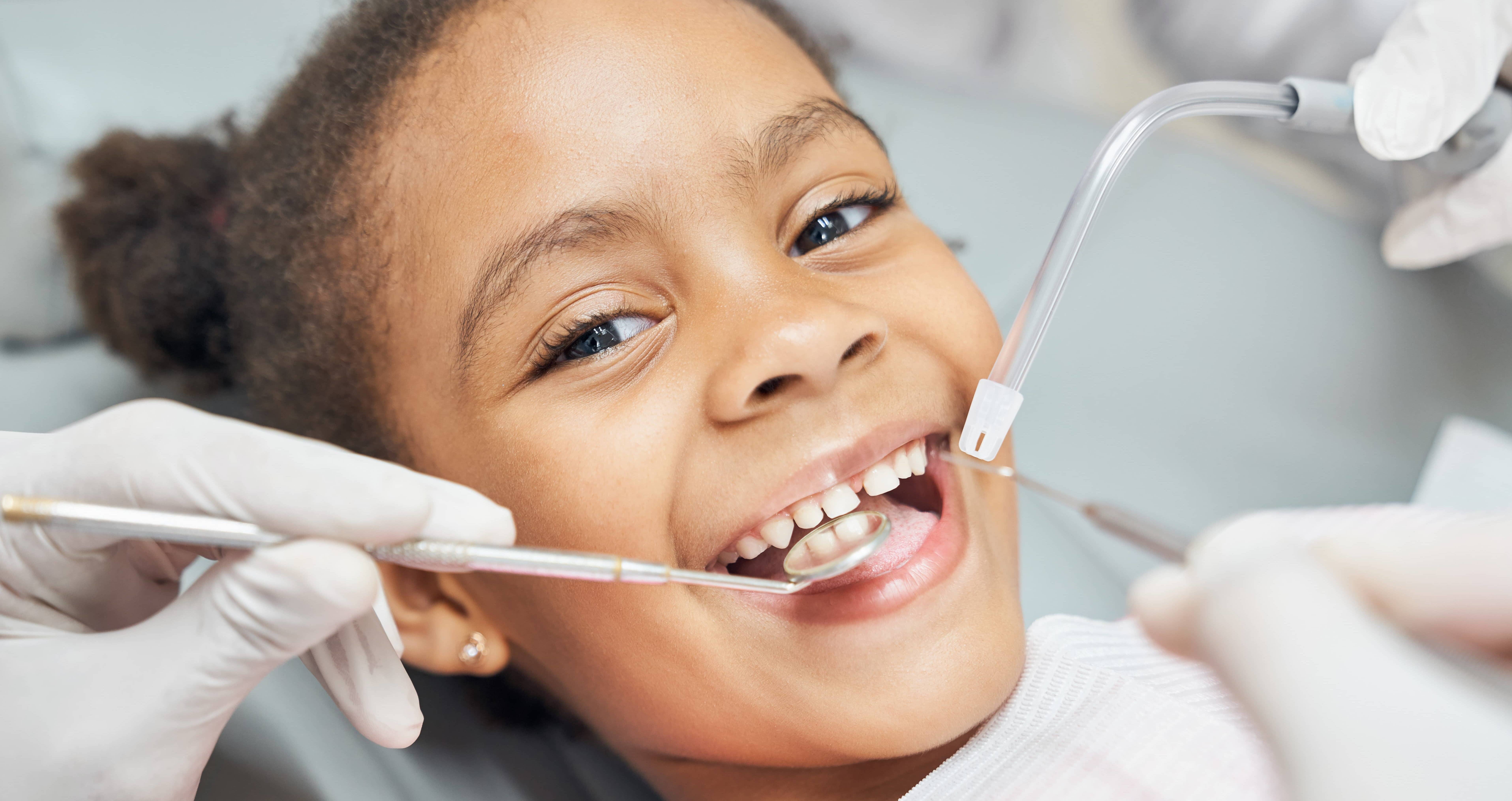 cute-african-girl-during-dental-treatment-at-modern-clinic