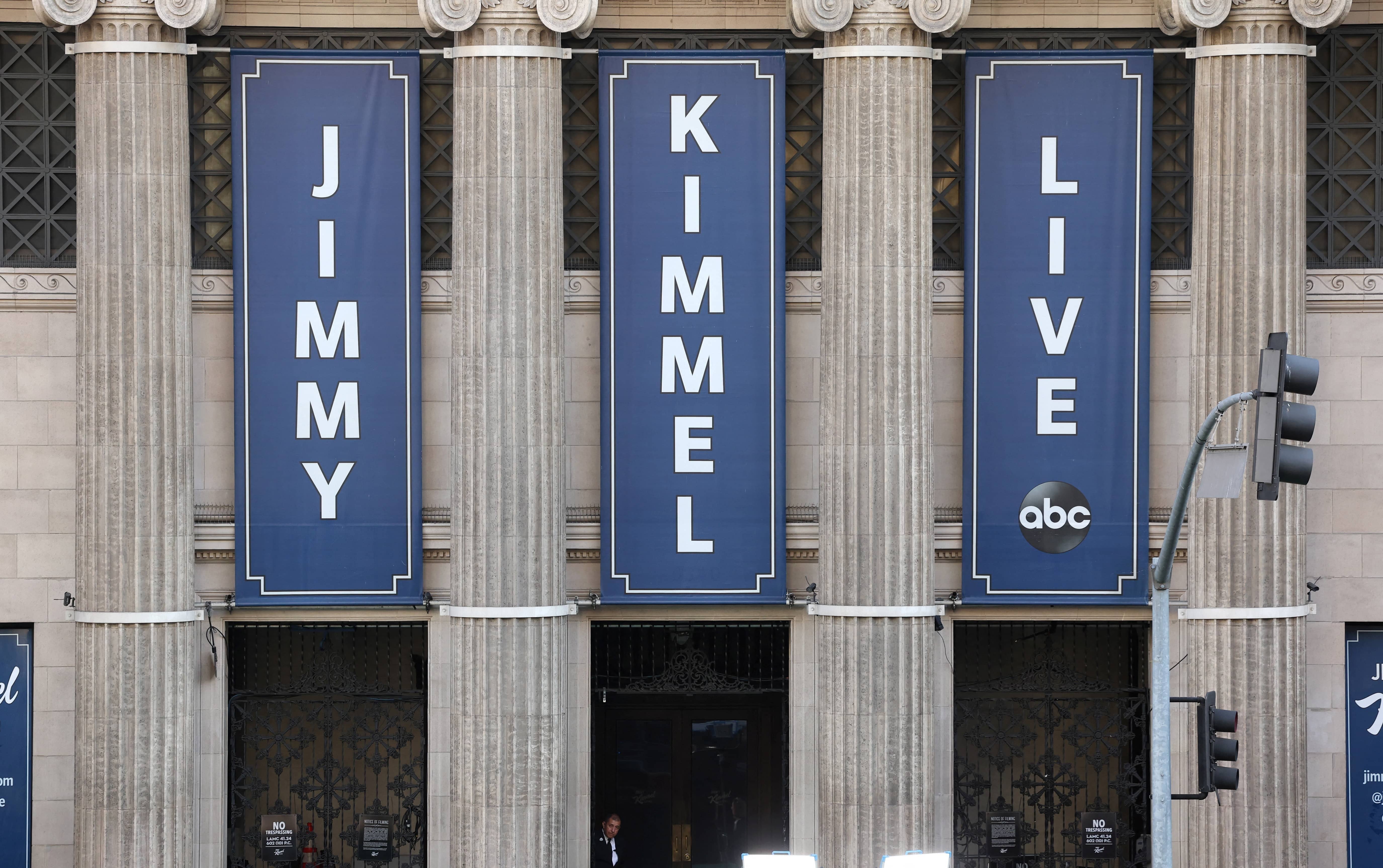 a-security-guard-stands-outside-ahead-of-the-taping-of-the-late-night-talk-show-jimmy-kimmel-live-at-the-hollywood-masonic-temple-in-los-angeles