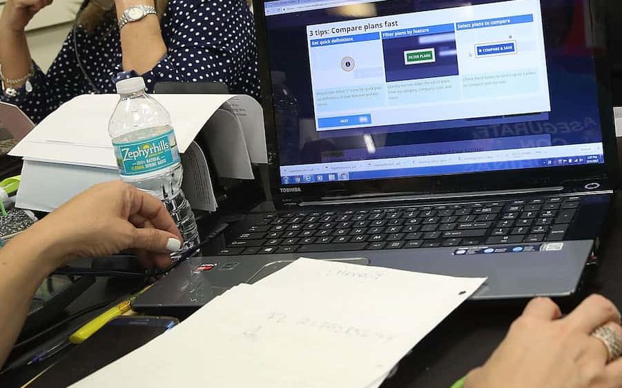 people-sign-up-for-health-care-coverage-under-the-affordable-care-act-during-first-day-of-open-enrollment