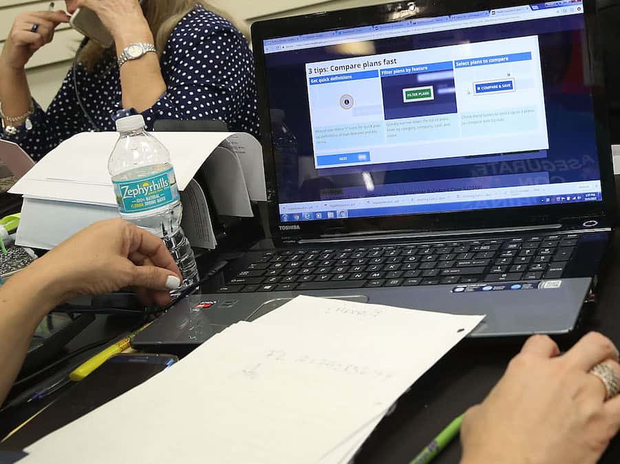 people-sign-up-for-health-care-coverage-under-the-affordable-care-act-during-first-day-of-open-enrollment