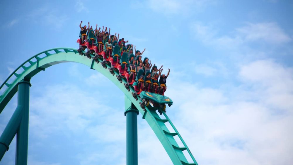 people-riding-a-rollercoaster-in-an-amusement-park