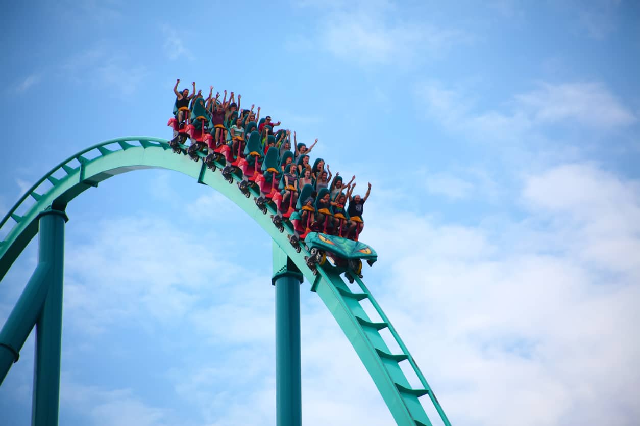 people-riding-a-rollercoaster-in-an-amusement-park