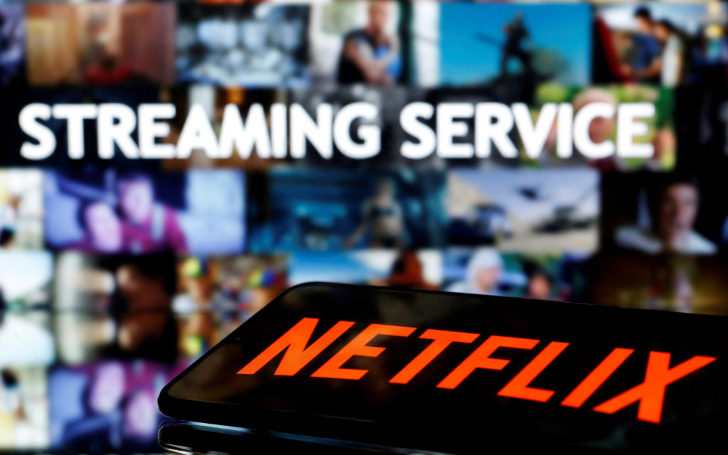 file-photo-a-smartphone-with-the-netflix-logo-lies-in-front-of-displayed-streaming-service-words-in-this-illustration