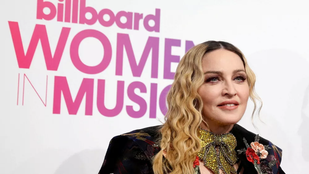 file-photo-madonna-poses-on-the-red-carpet-a-the-billboard-magazines-11th-annual-women-in-music-luncheon-in-new-york