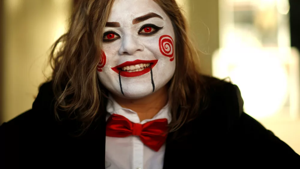 person-dressed-up-as-jigsaw-poses-during-a-halloween-event-in-sierra-madre