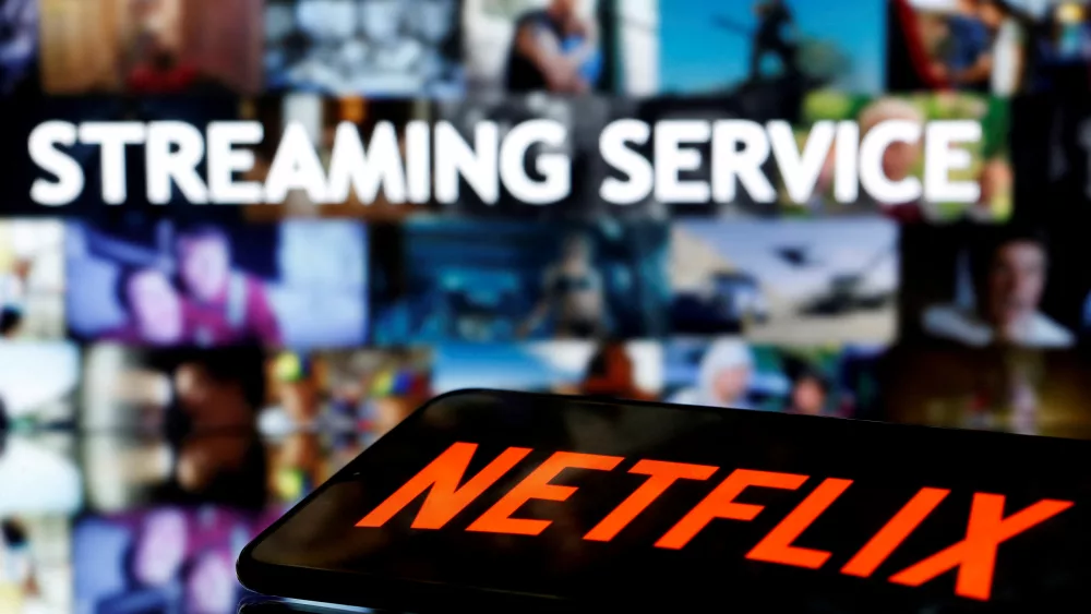 file-photo-a-smartphone-with-the-netflix-logo-lies-in-front-of-displayed-streaming-service-words-in-this-illustration-2