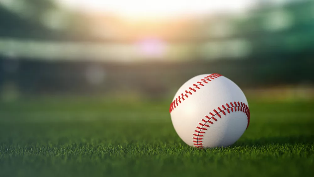 baseball-ball-in-a-grass-of-baseball-arena-stadium