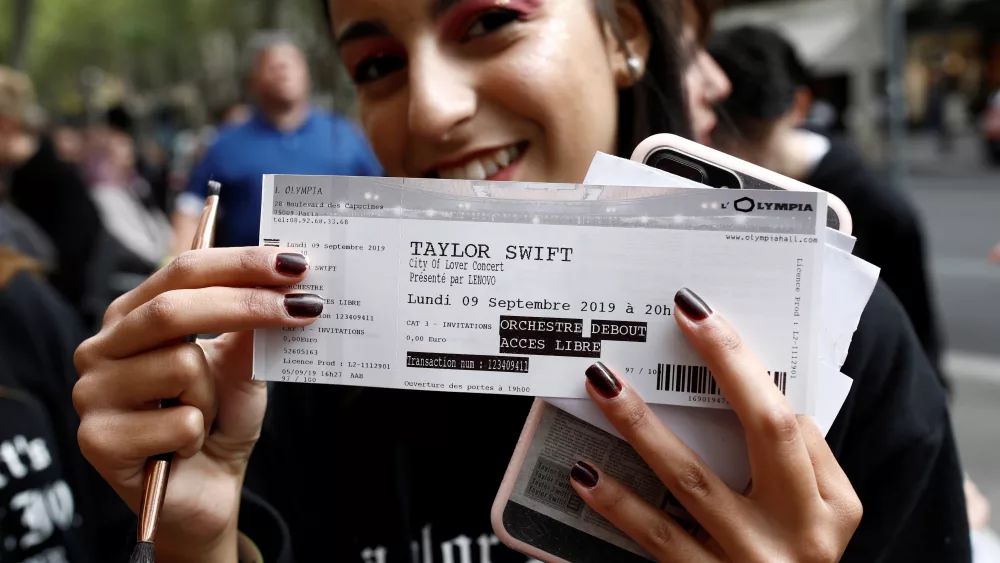 a-fan-of-taylor-swift-holds-up-her-ticket-prior-to-a-concert-performance-at-the-olympia-theatre-in-paris