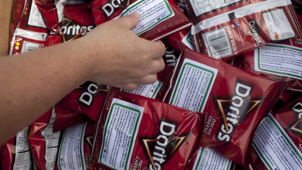 seattle-police-department-officers-hand-out-bags-of-doritos-to-festival-goers-during-the-hempfest-rally-in-seattle