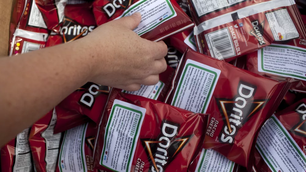 seattle-police-department-officers-hand-out-bags-of-doritos-to-festival-goers-during-the-hempfest-rally-in-seattle-2