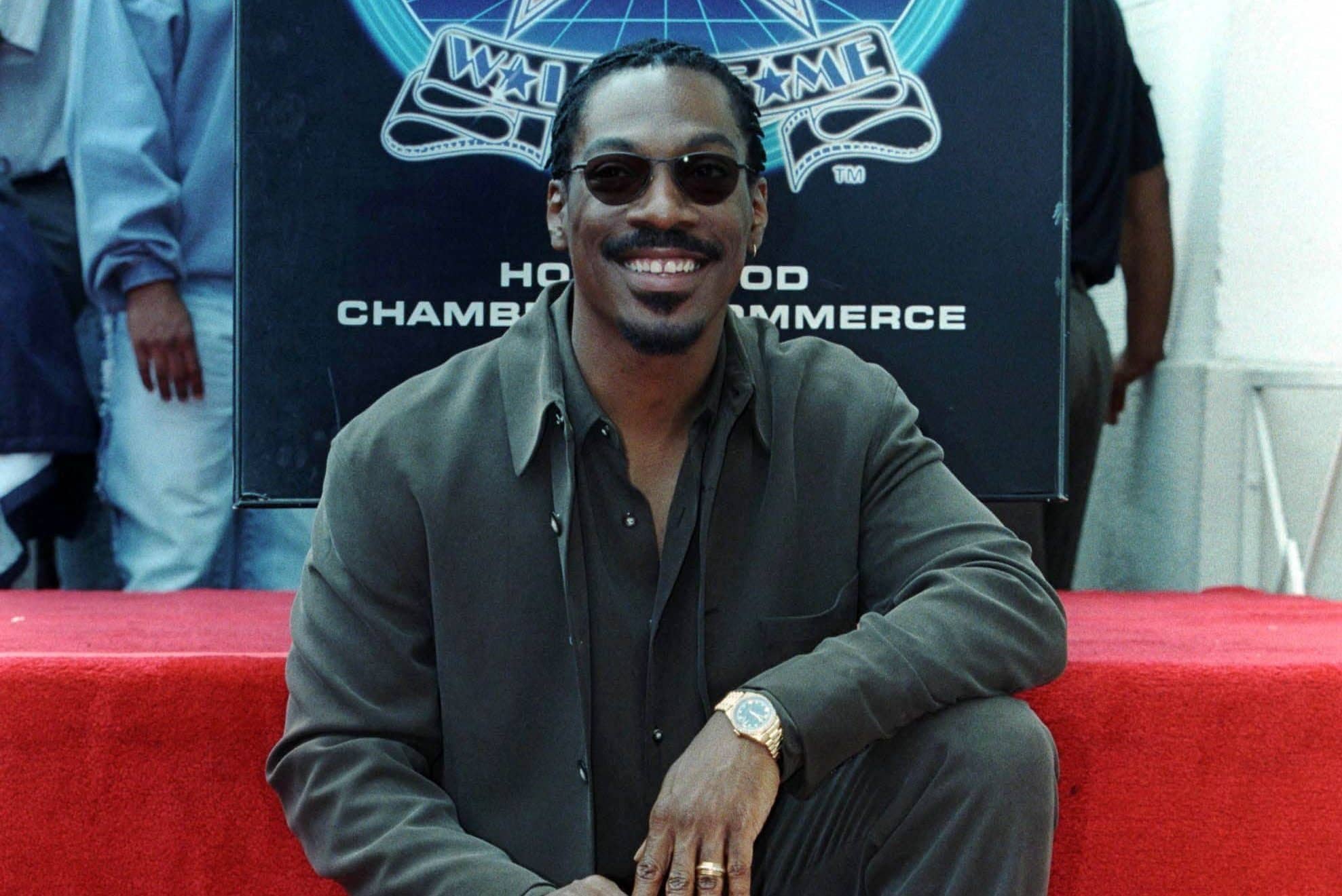 eddie-murphy-poses-with-his-star-on-the-hollywood-walk-of-fame