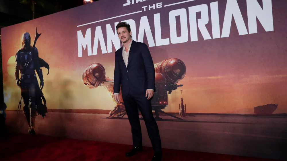 cast-member-pascal-poses-at-the-premiere-for-the-television-series-the-mandalorian-in-los-angeles