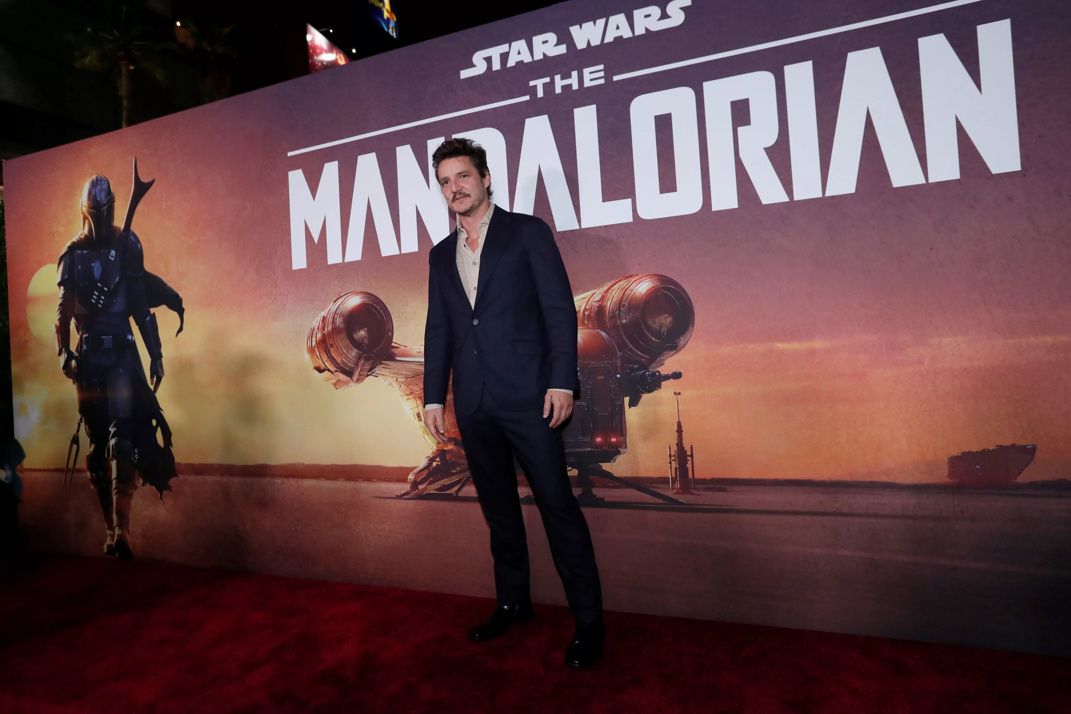 cast-member-pascal-poses-at-the-premiere-for-the-television-series-the-mandalorian-in-los-angeles