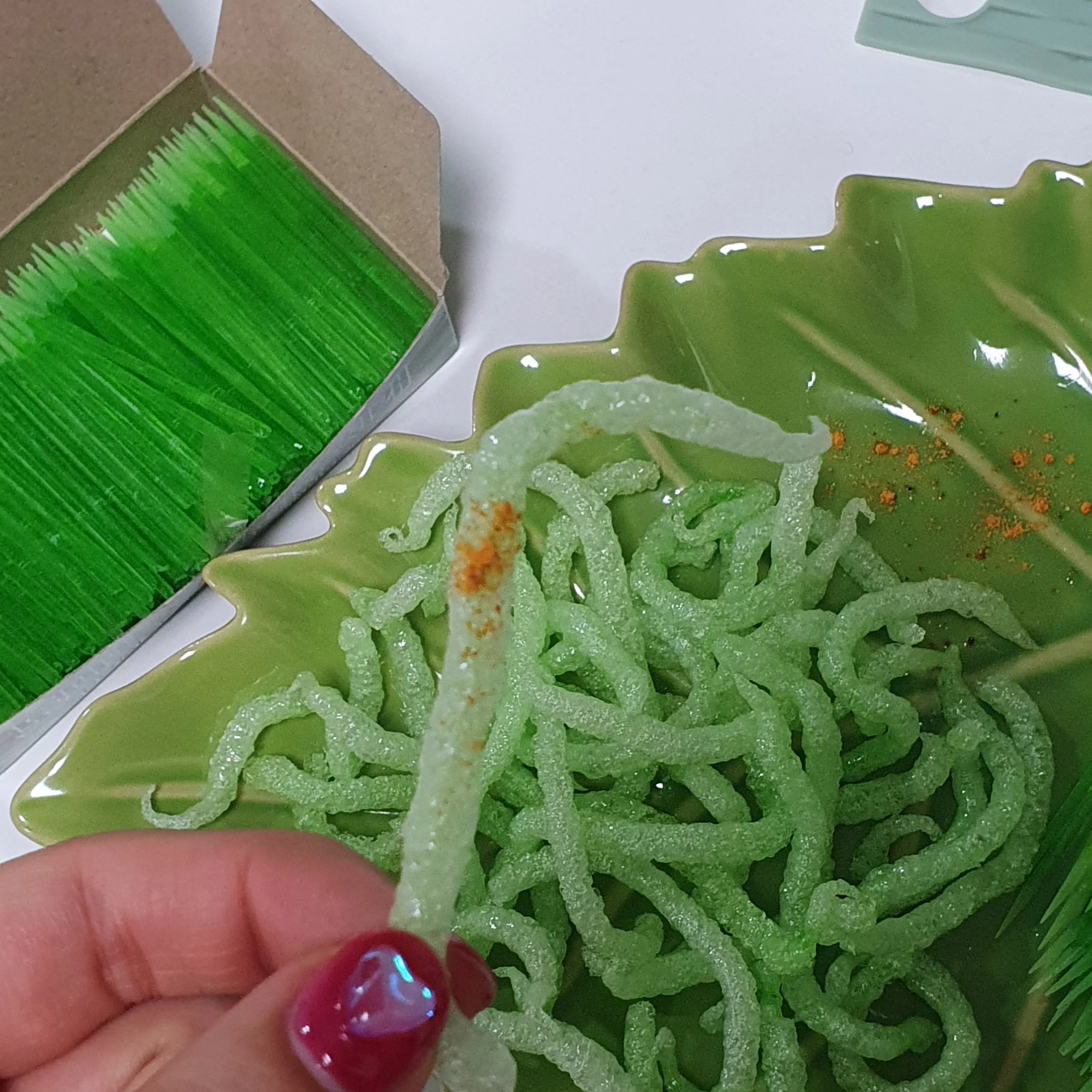 a-person-holds-a-fried-green-toothpick-which-went-viral-following-a-social-media-trend-against-which-south-koreas-food-and-drug-safety-authorities-have-issued-warnings-regarding-its-consumption-i