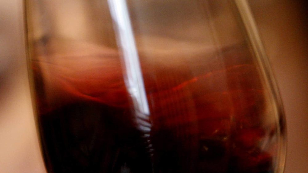 a-wine-selector-tastes-red-wine-from-the-latest-vintage-at-bonini-winerys-wine-cellar-in-brestovitsa-2