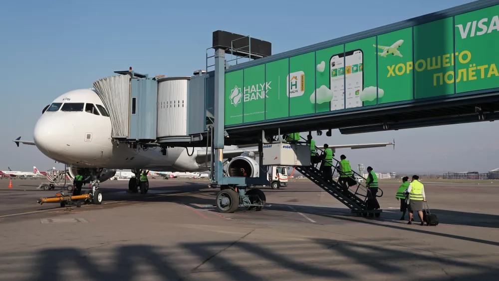 air-astana-employees-board-a-plane-at-almaty-international-airport