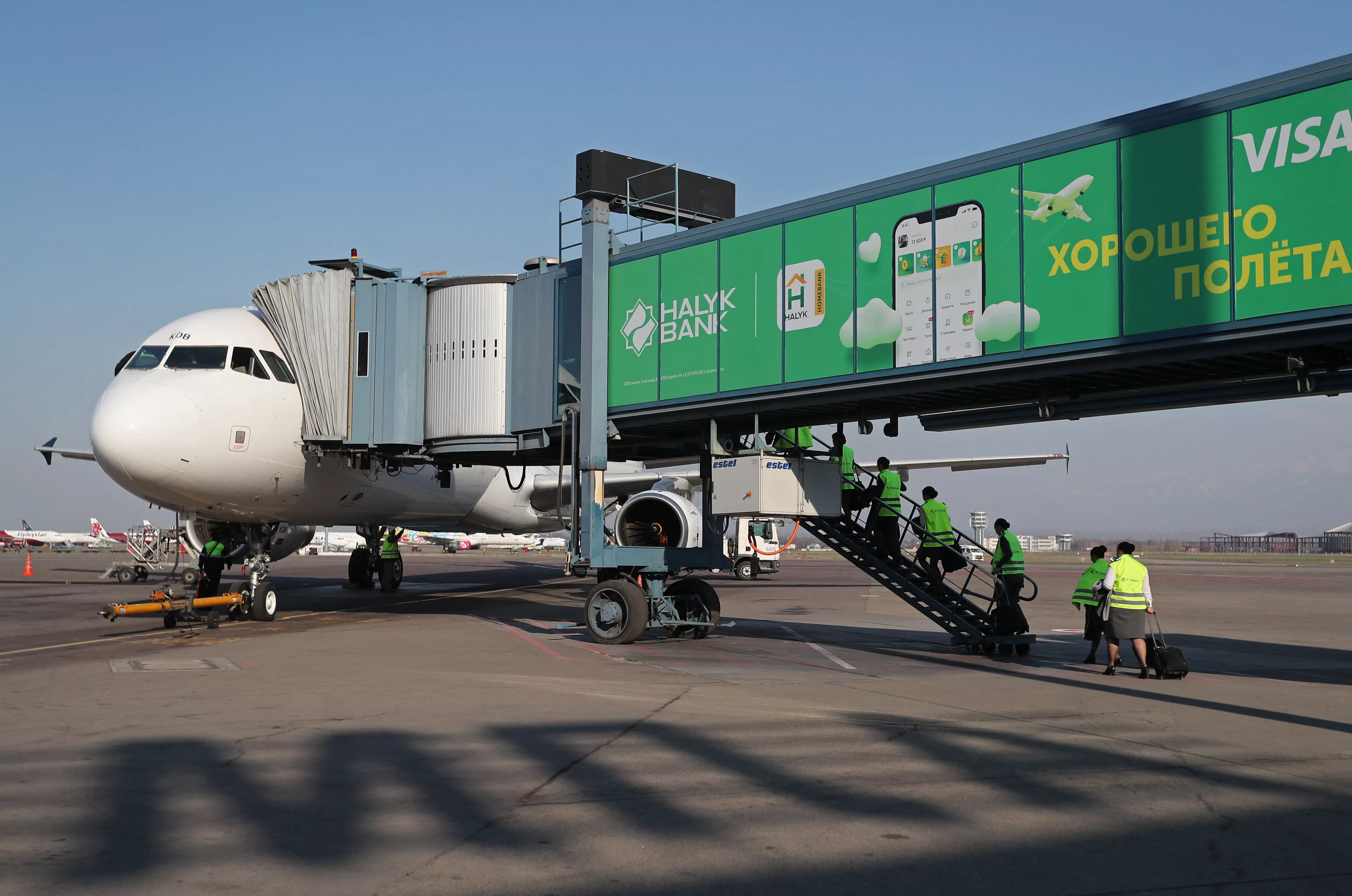 air-astana-employees-board-a-plane-at-almaty-international-airport