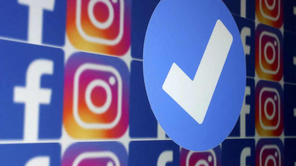 file-photo-illustration-shows-blue-verification-badge-facebook-and-instagram-logos