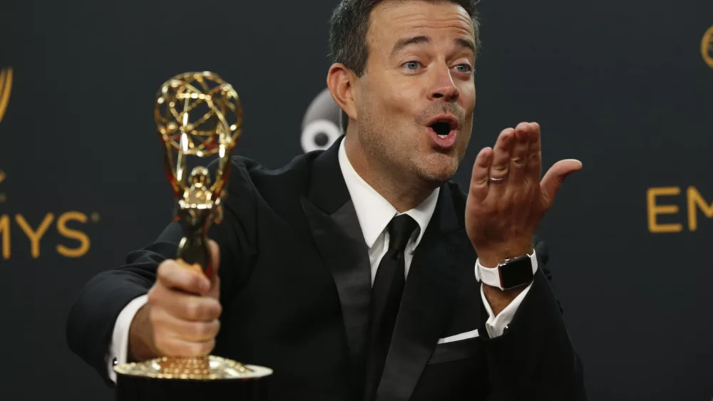 carson-daly-poses-backstage-with-his-award-for-outstanding-reality-competition-program-for-the-voice-at-the-68th-primetime-emmy-awards-in-los-angeles