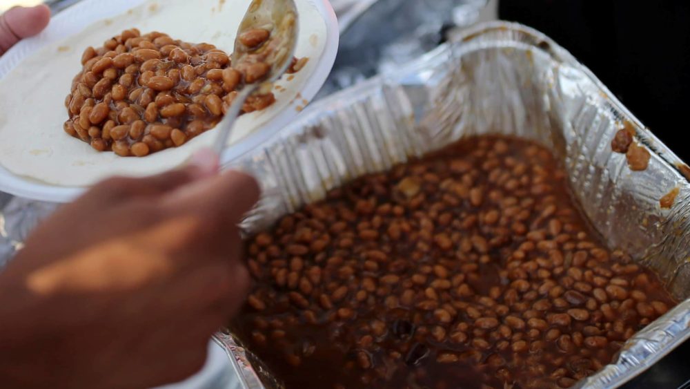 activists-serve-beans-for-delegates-entering-the-wells-fargo-center-as-part-of-a-fart-in-demonstration-against-politics-they-say-stink-on-the-third-day-of-the-democratic-national-convention-in-phi