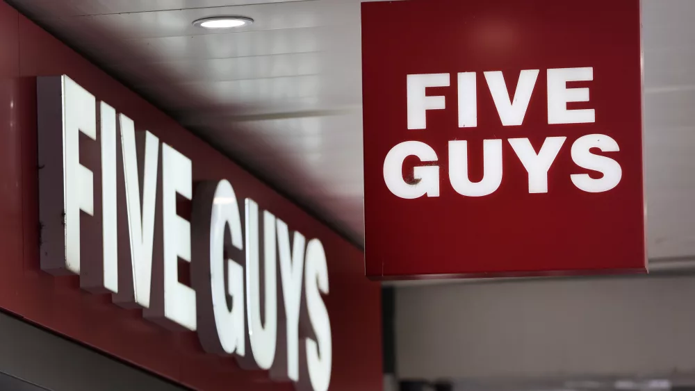 a-logo-is-pictured-in-front-of-a-fast-food-chain-restaurant-five-guys-in-geneva