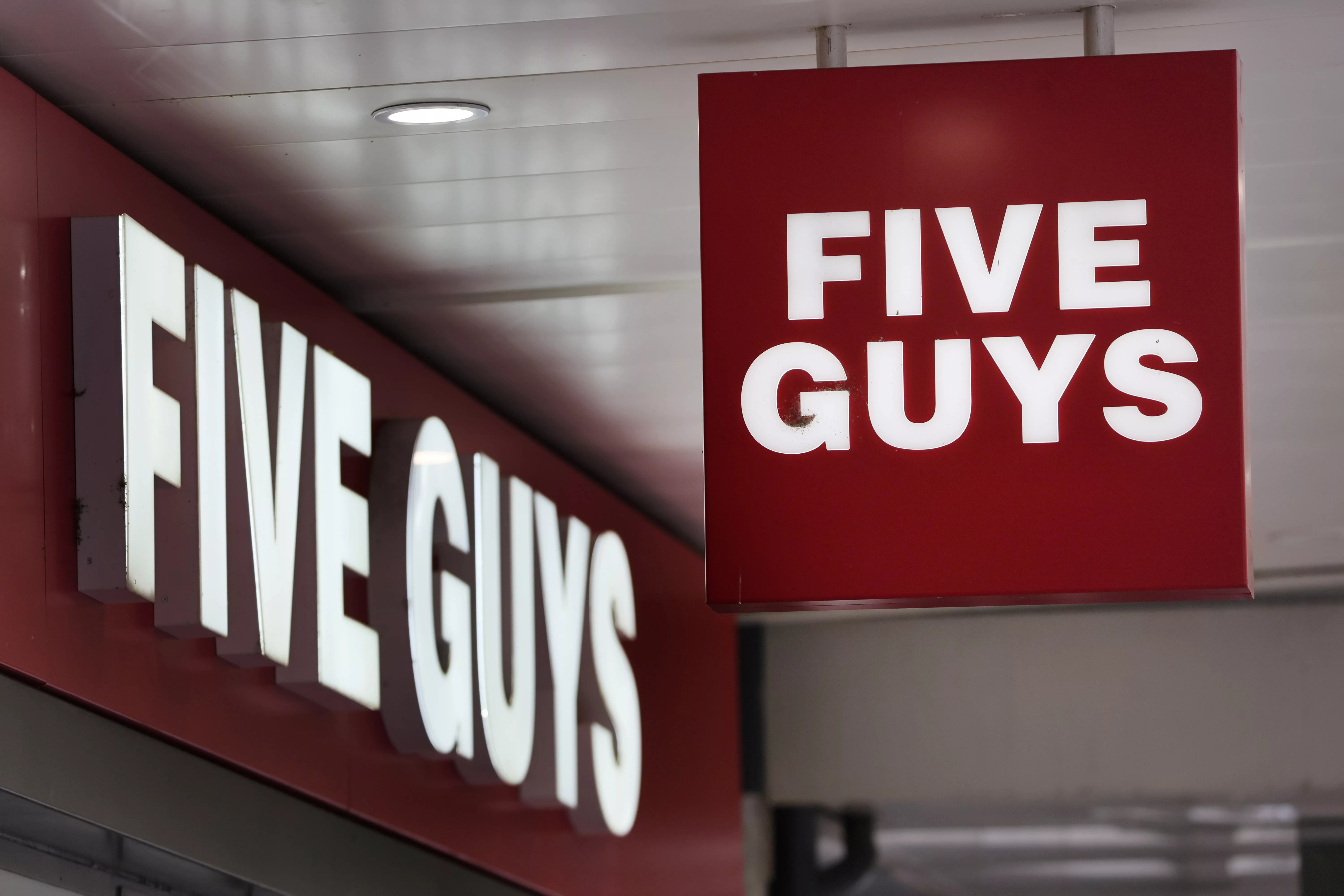 a-logo-is-pictured-in-front-of-a-fast-food-chain-restaurant-five-guys-in-geneva