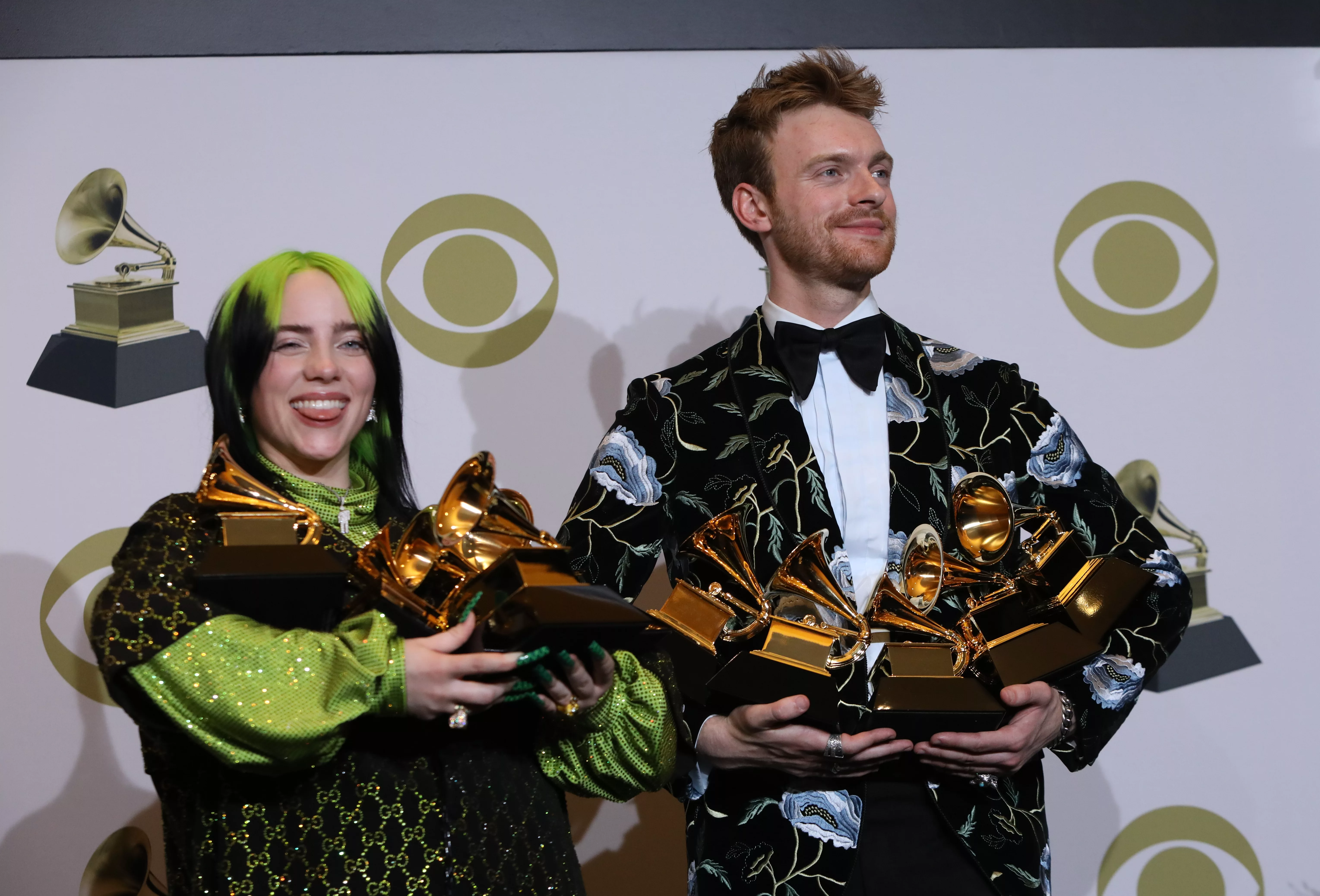 62nd-grammy-awards-photo-room-los-angeles-california-u-s-january-26-2020-billie-eilish-and-finneas-oconnell-pose-backstage-with-her-awards