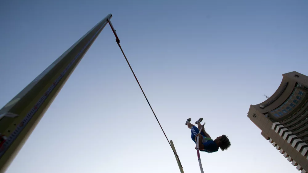 french-nicolas-durand-jumps-during-a-competition-at-the-urban-pole-vault-demonstration-organised-to-promote-an-energy-drink-in-downtown-bucharest