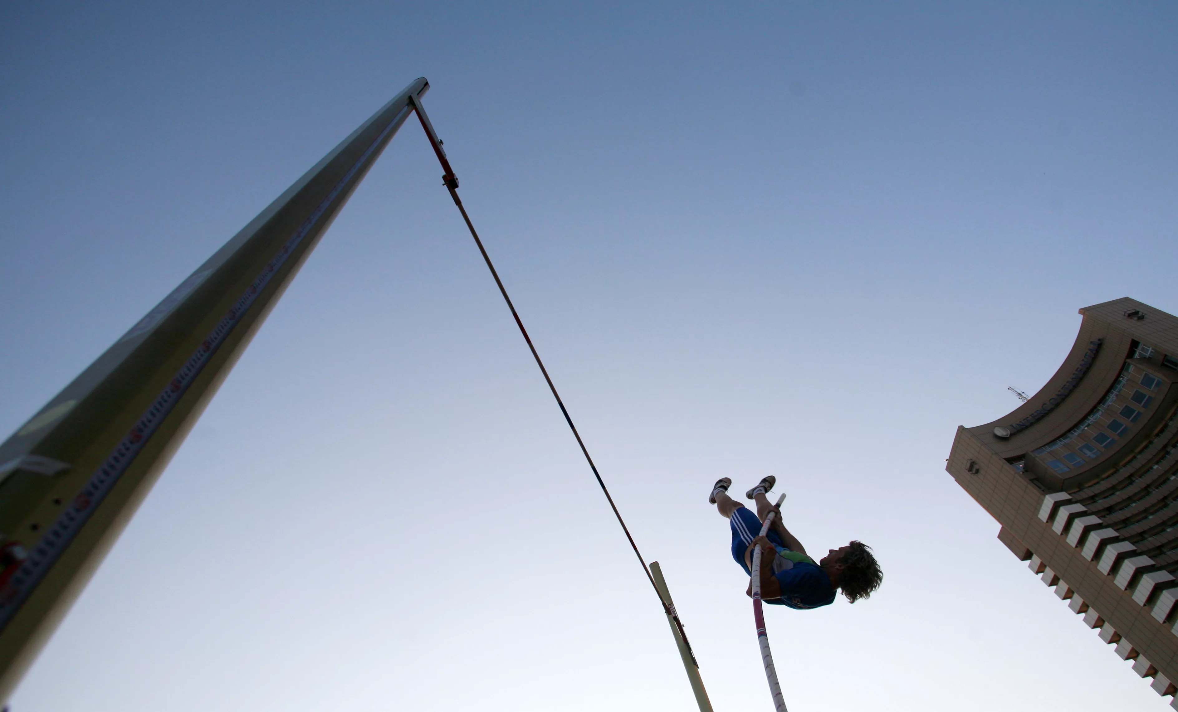 french-nicolas-durand-jumps-during-a-competition-at-the-urban-pole-vault-demonstration-organised-to-promote-an-energy-drink-in-downtown-bucharest