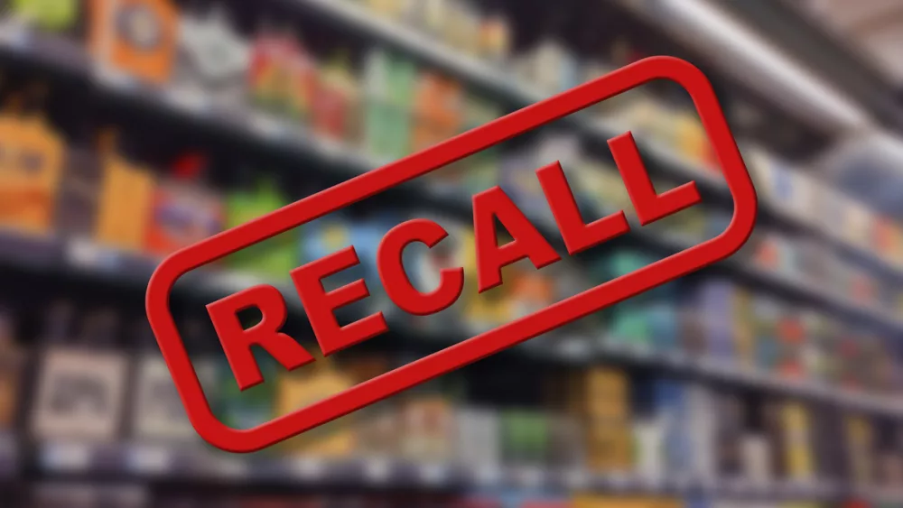 blurry-interior-of-a-grocery-store-aisle-behind-large-red-recall-text