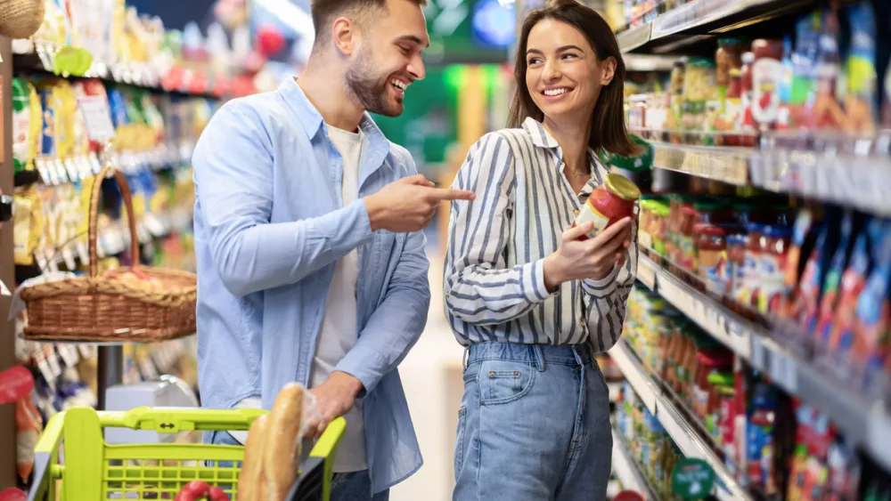 young-happy-couple-with-the-cart-shopping-in-supermarket