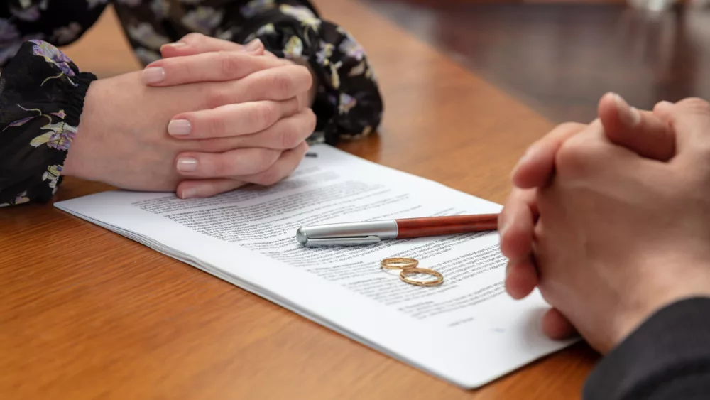 divorce-signature-marriage-dissolution-document-wedding-ring-and-agreement-on-lawyer-office-table