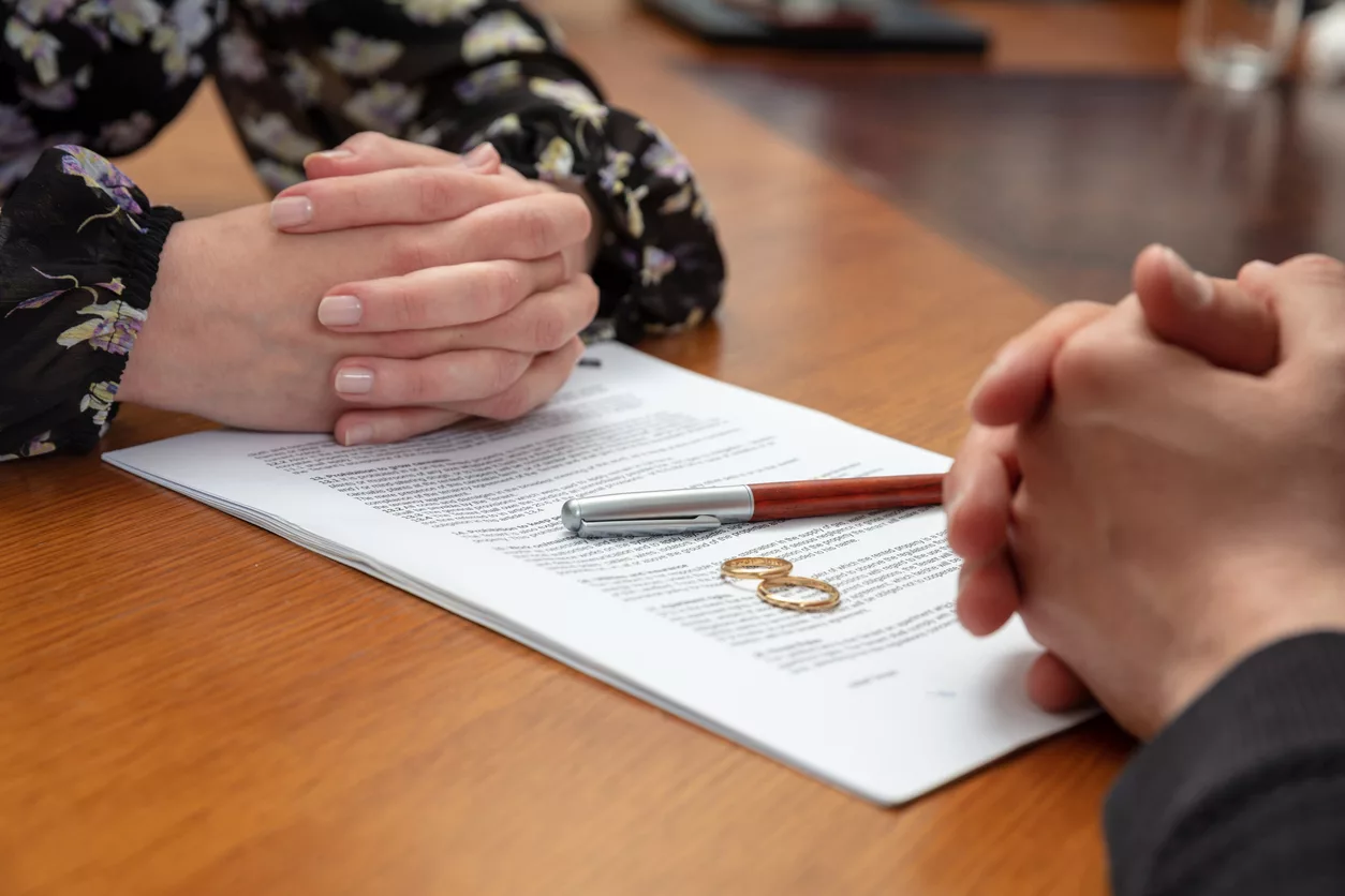 divorce-signature-marriage-dissolution-document-wedding-ring-and-agreement-on-lawyer-office-table
