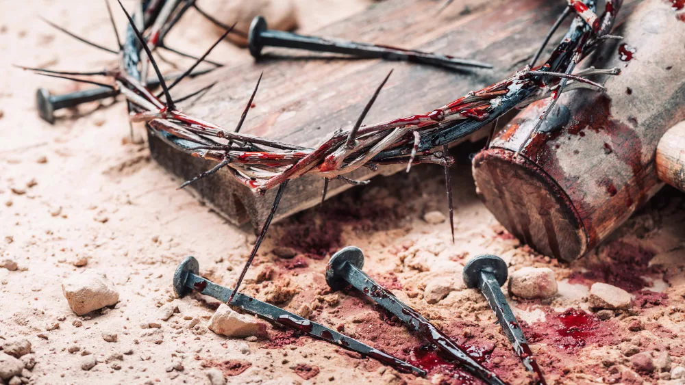 old-wooden-cross-hammer-bloody-nails-and-crown-of-thorns-on-ground-banner-copy-space-good-friday-passion-crucifixion-of-jesus-christ-christian-easter-holiday-gospel-salvation