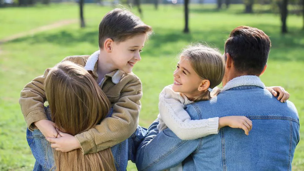 back-view-of-family-hugging-each-other