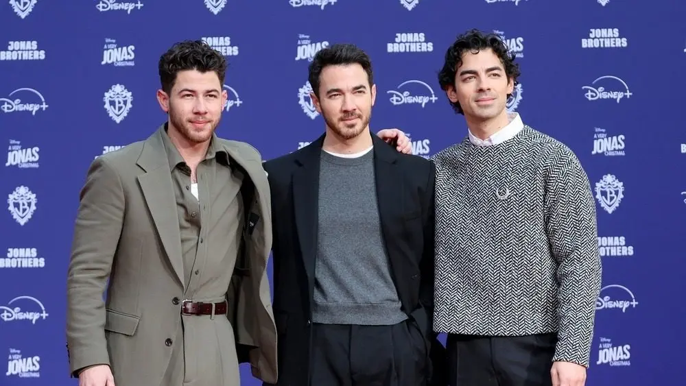 Nick Jonas^ Kevin Jonas^ Joe Jonas at Jonas Brothers Hand And Footprint In Cement Ceremony at the TCL Chinese Theater IMAX on December 3^ 2025 in Los Angeles^ CA