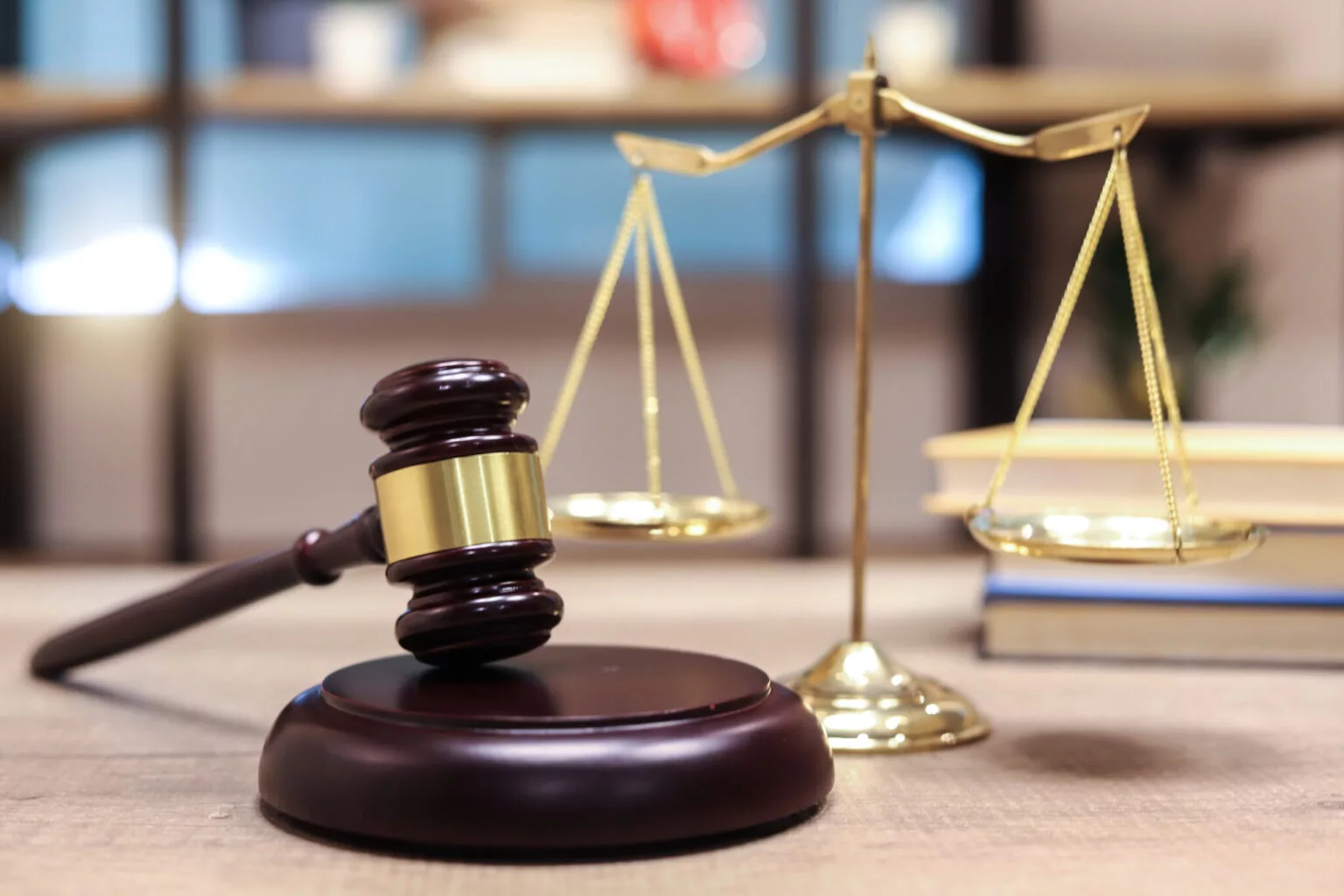 justice-scales-and-books-and-wooden-gavel